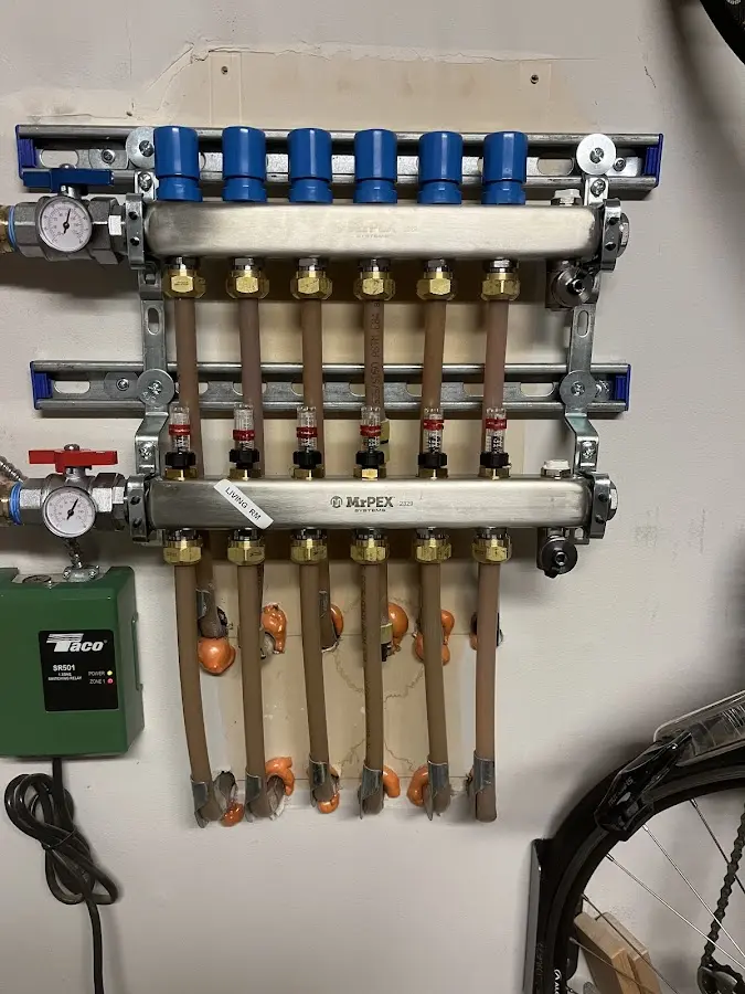 Plumber performing Water Heater Repair at a residential property in Shawnee